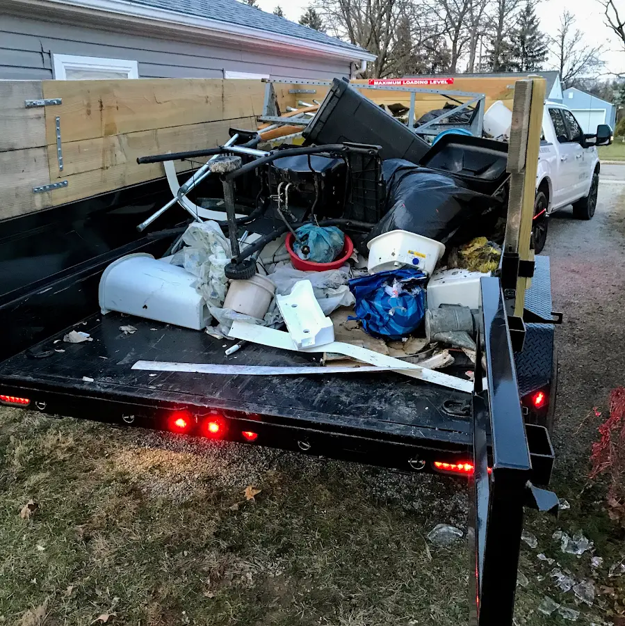 Roll-off dumpster delivered to a residential driveway in Enoch